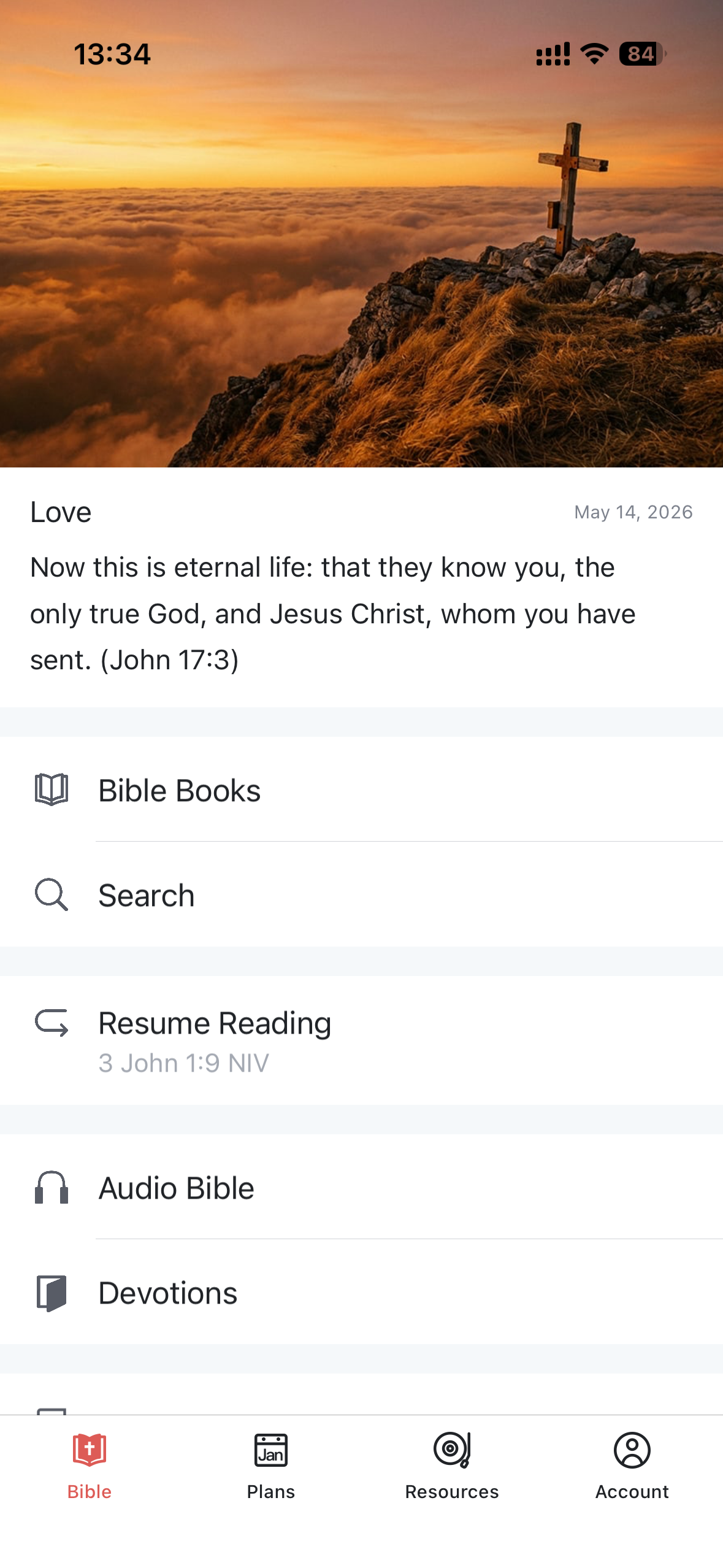 WeDevote Bible home screen on iPhone with a daily verse and a menu for Bible, Search, Resume, Audio, and Devotions